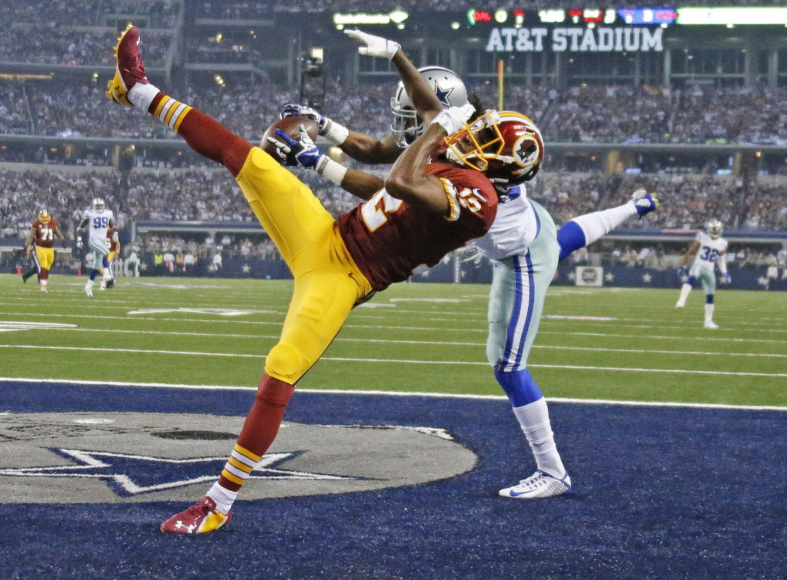 Dallas Cowboys strong safety J.J. Wilcox (27) intercepts a pass intended for Washington...