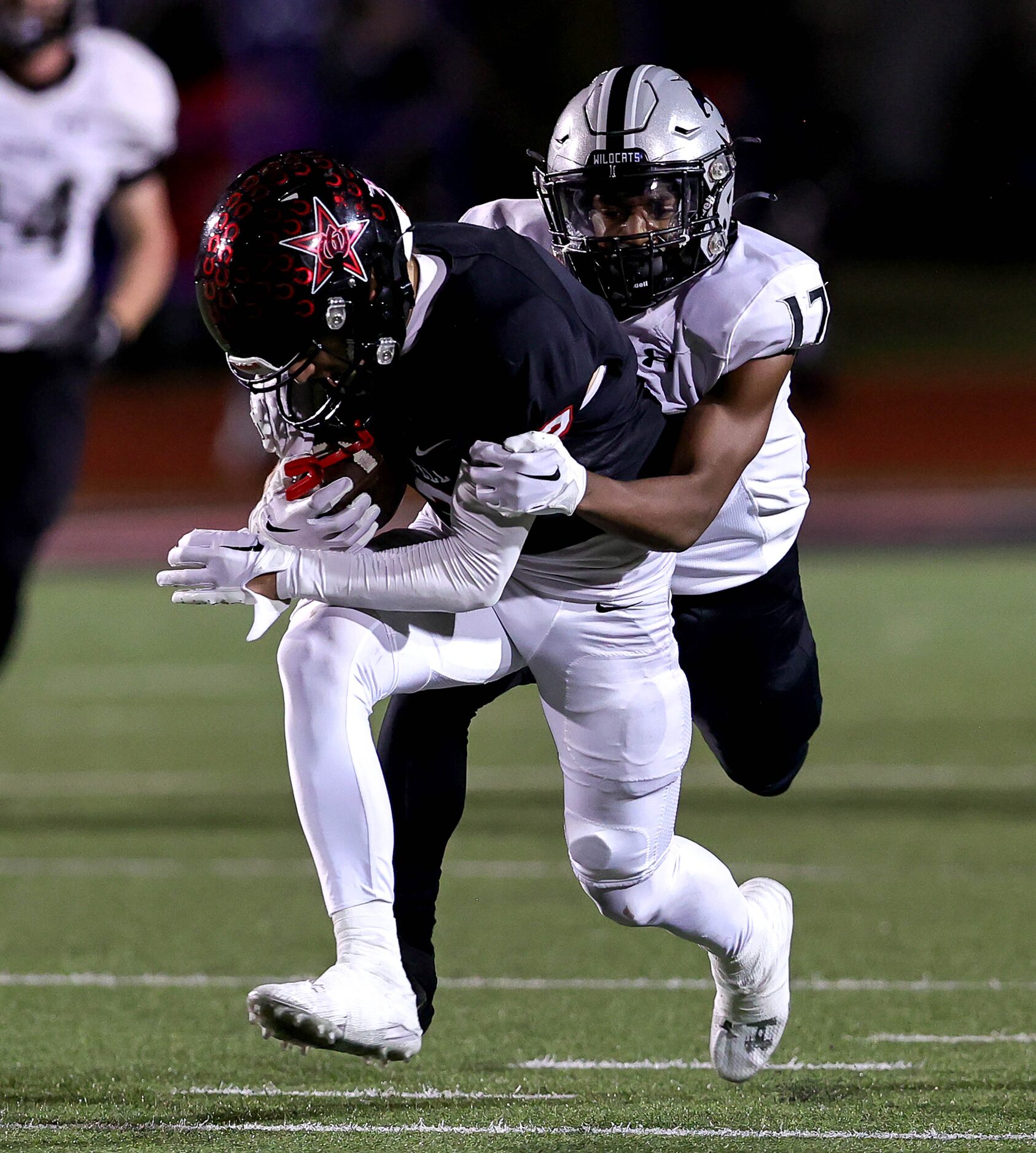 Coppell wide receiver Luca Grosoli (2) comes up with a reception against Denton Guyer...