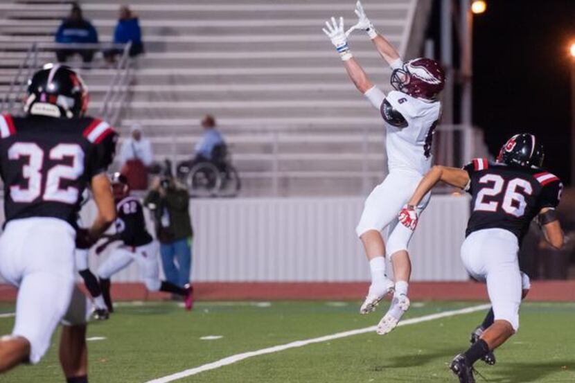 Rowlett senior wide receiver Tyler Hogan (6) jumps up for a catch against North Garland on...