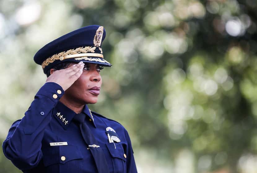 Dallas Police Chief U. Renee Hall salutes for the national anthem during an unveiling...