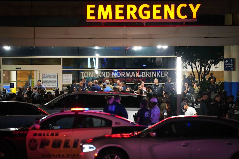 Dallas police gather at Methodist Dallas Medical Center early Friday, Aug. 30, 2024, in...