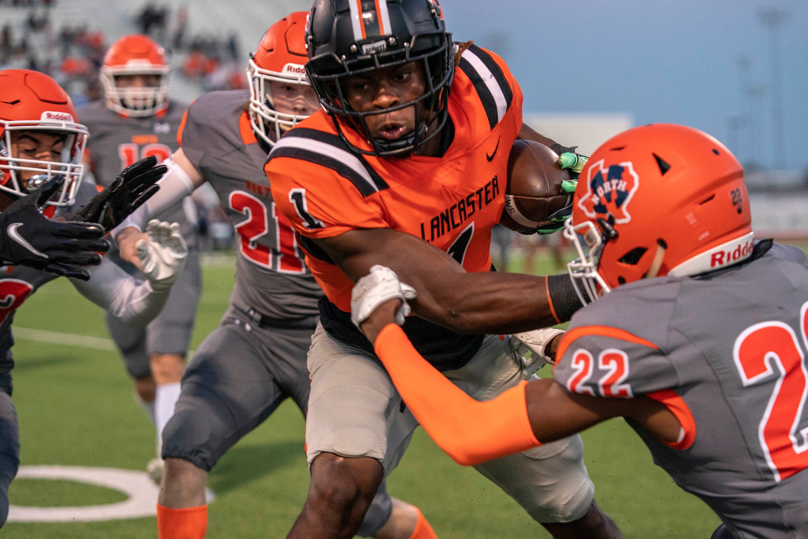 Lancaster senior running back Kyson Brown sheds the tackle of McKinney North senior...