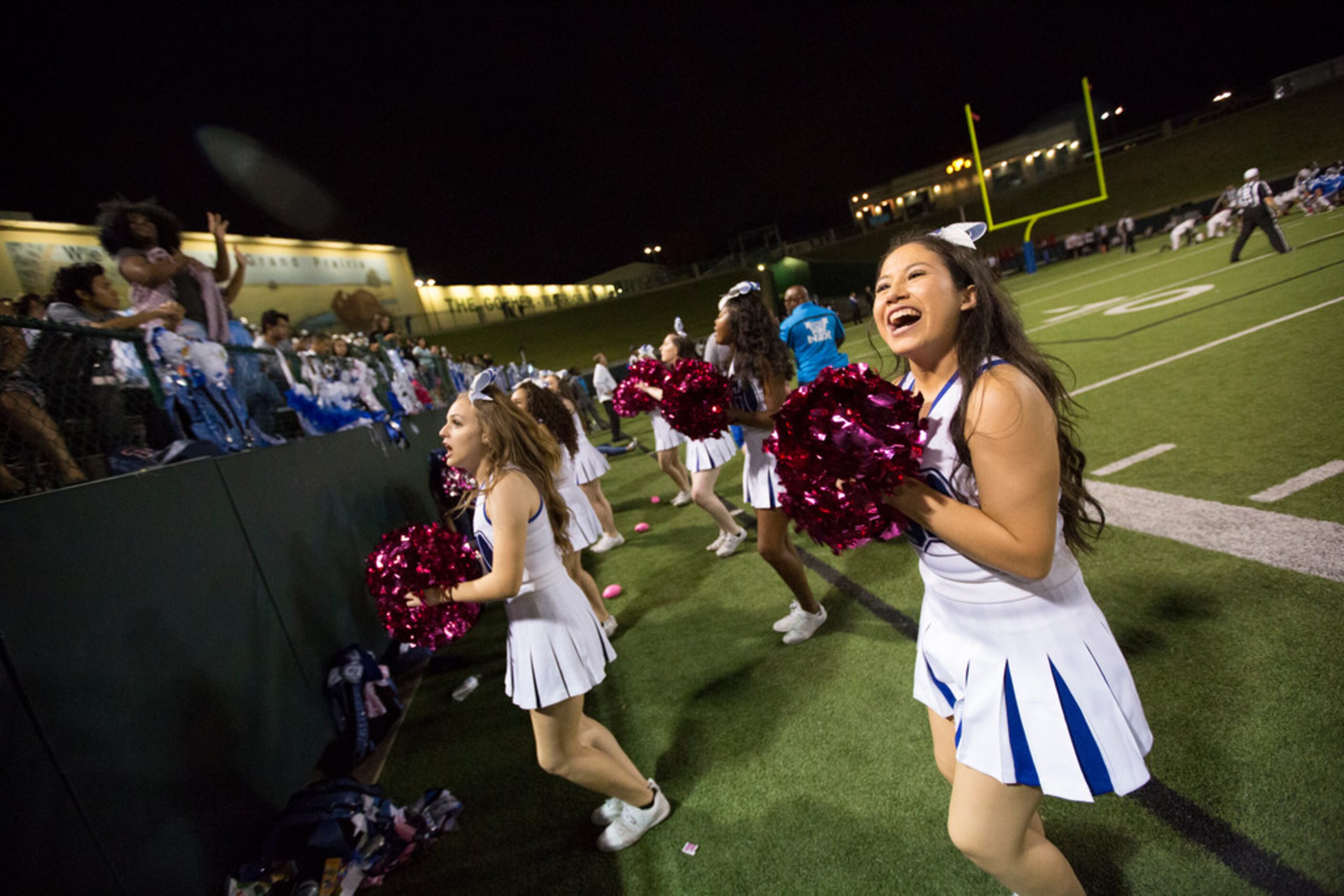 The Grand Prairie cheer squad performs for the crowd during a District 7-6A matchup between...