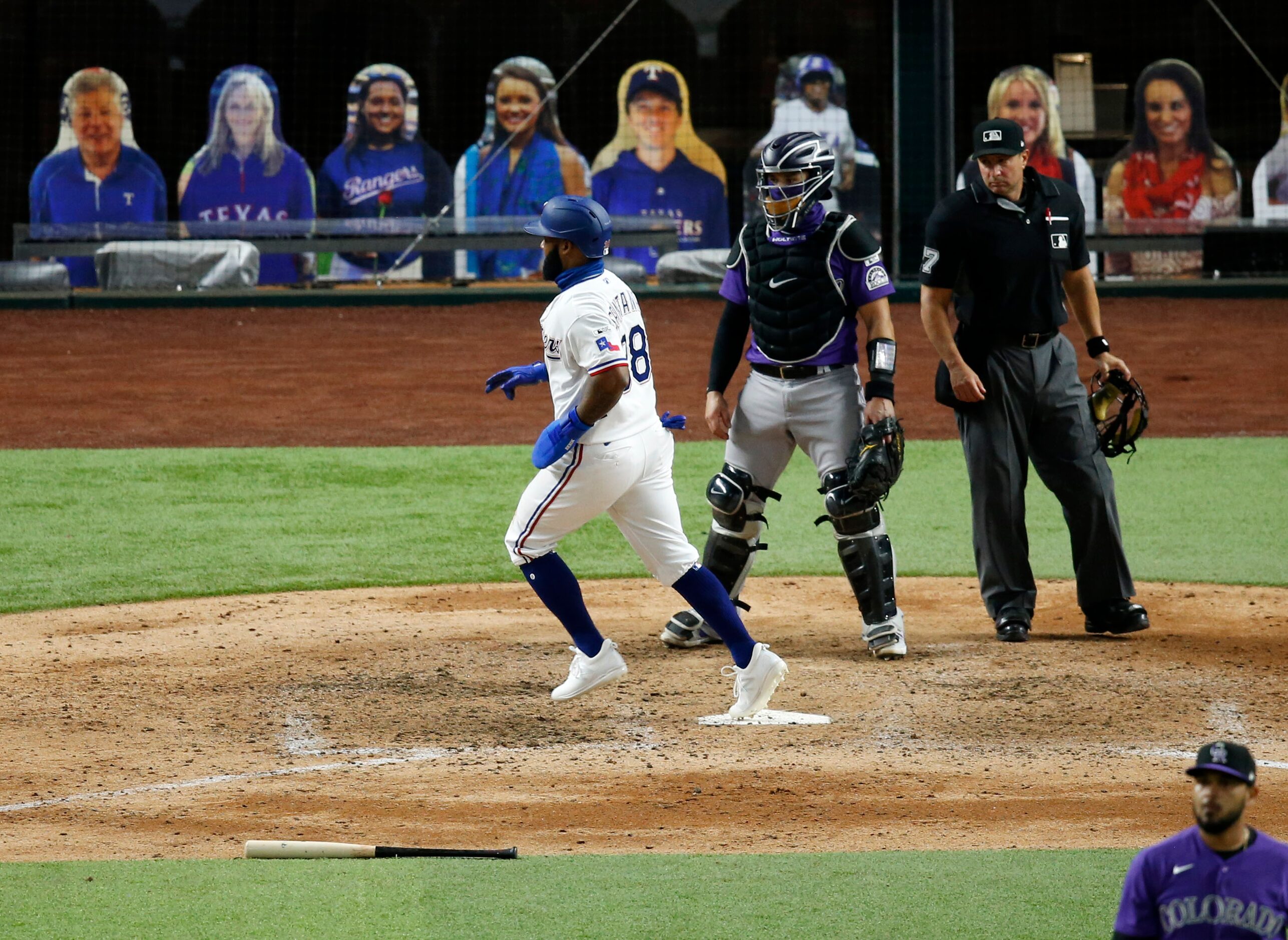 Texas Rangers second baseman Danny Santana (38) scores the first run of the game off a...