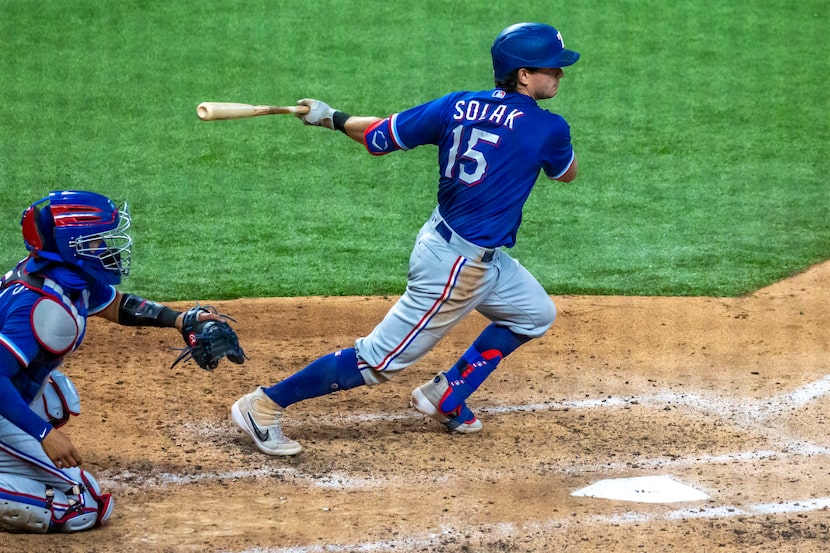 Texas Rangers outfielder Nick Solak runs for first during an intrasquad game at Summer Camp...