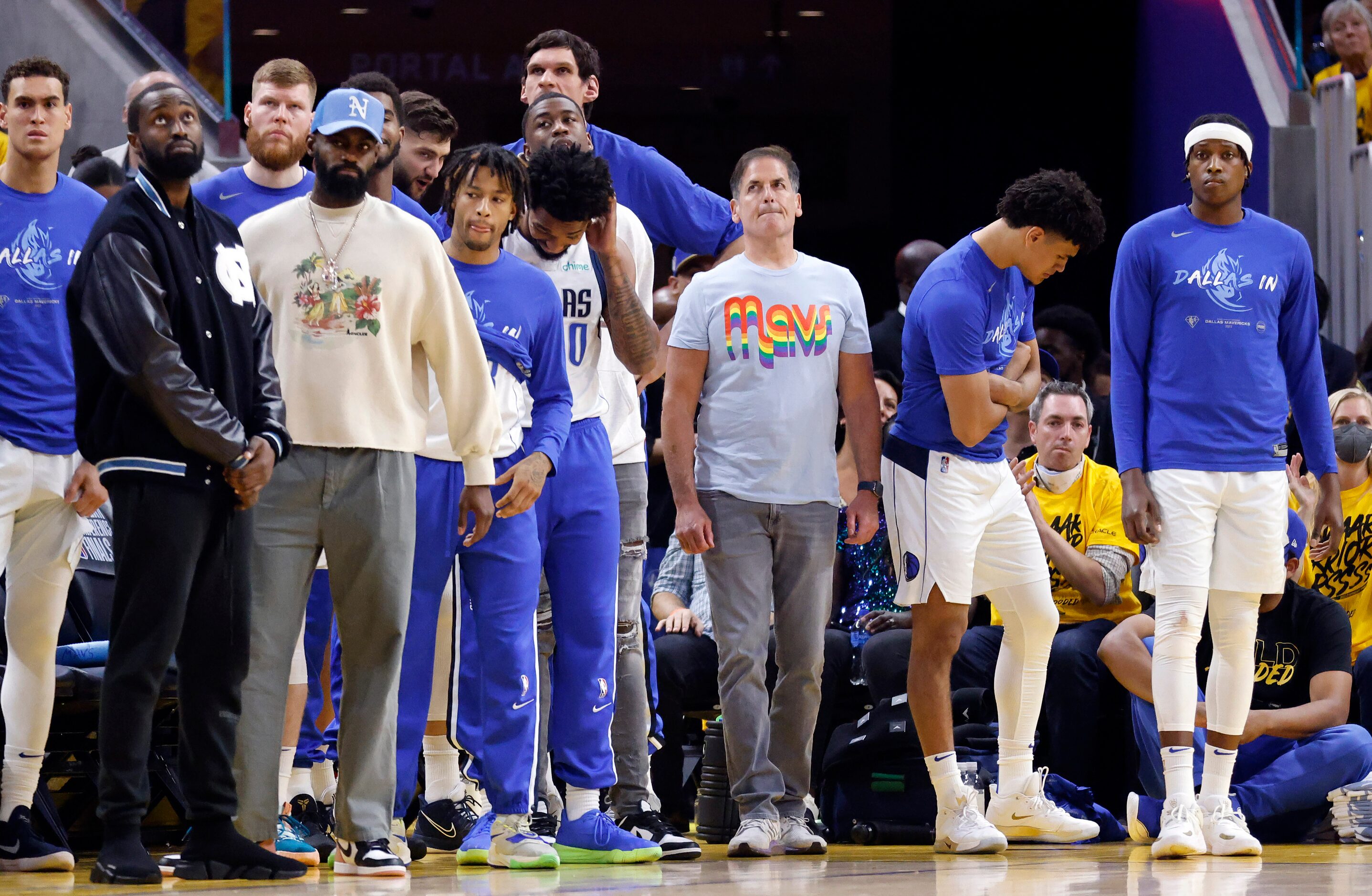 Dallas Mavericks owner Mark Cuban and his team watch as the Golden State Warriors hold the...