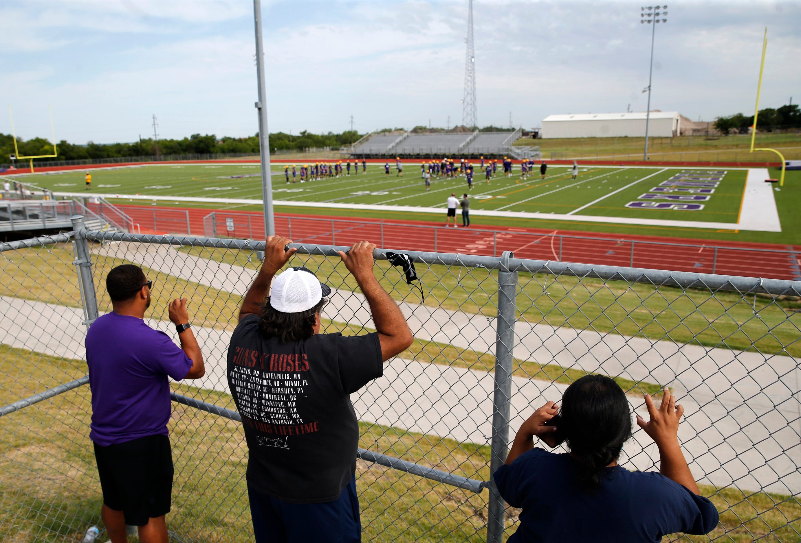 Parents of players Aaron Clark (left), Jose Chairez (center) and Corina Chairez (far right)...