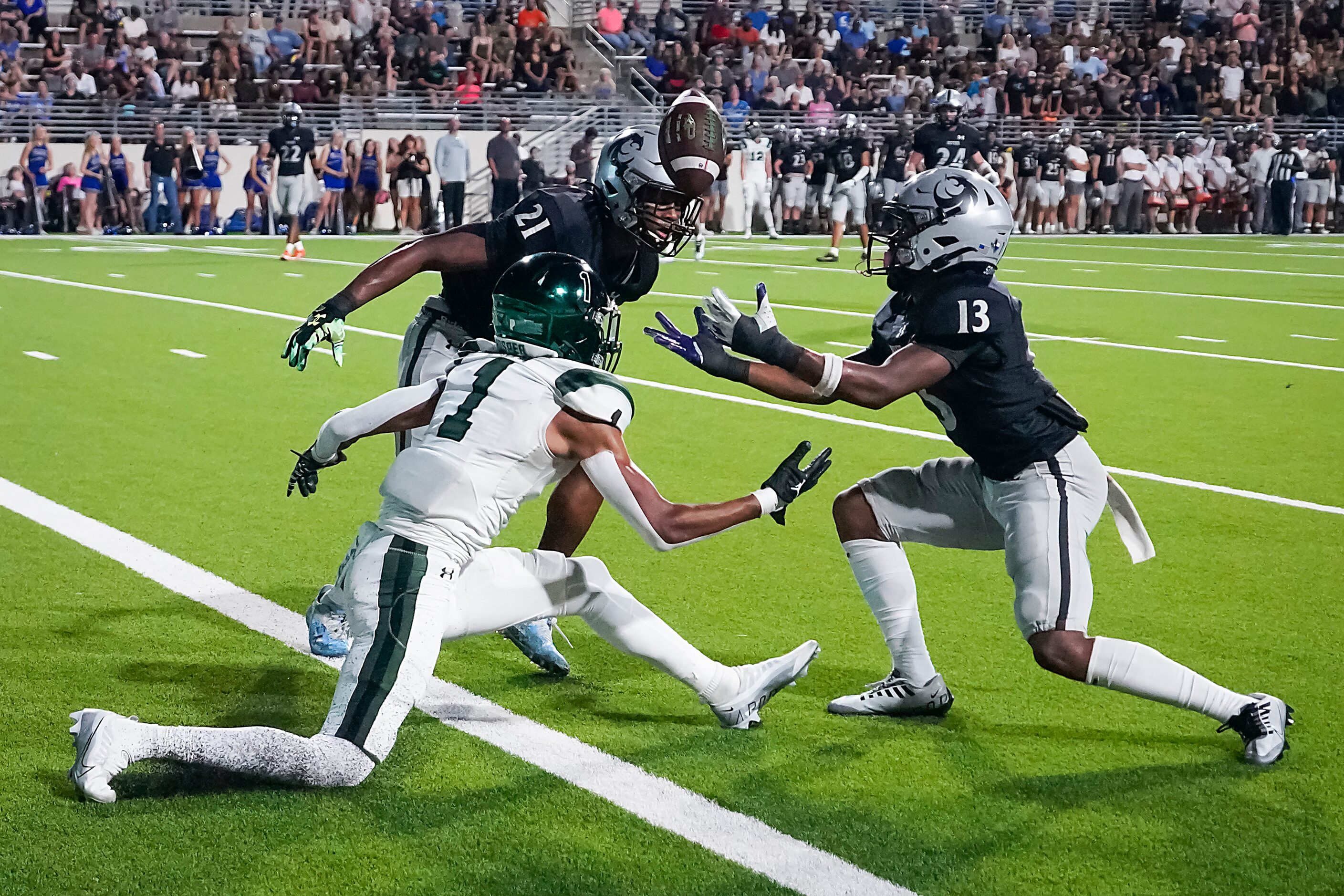 Denton Guyer defensive back Anthony Benford (13) reaches for a pass intended for Prosper...