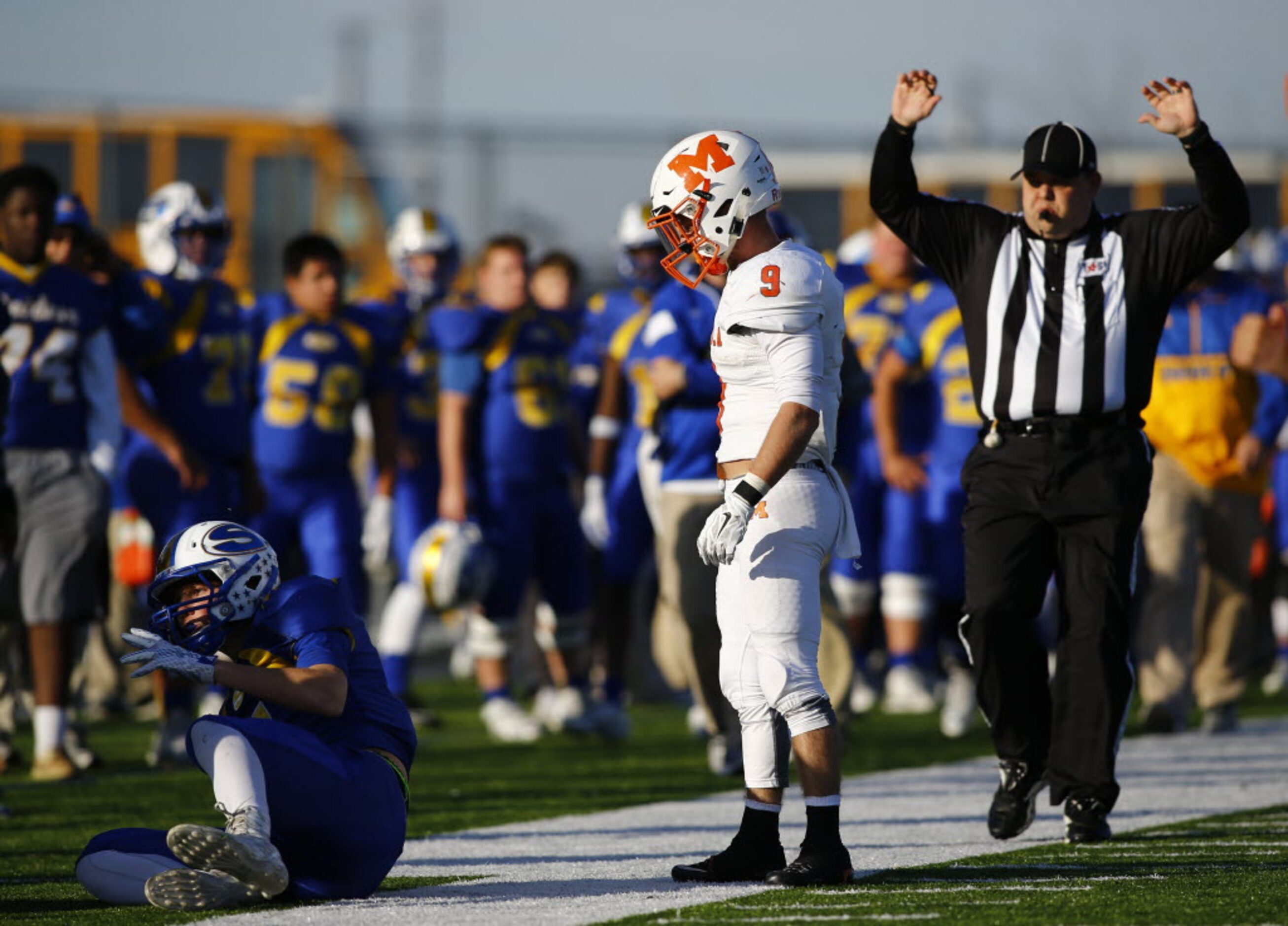 TXHSFB Mineola's Chantz Perkins (9) looks down at Sunnyvale's Cash Goodhart (5) after...