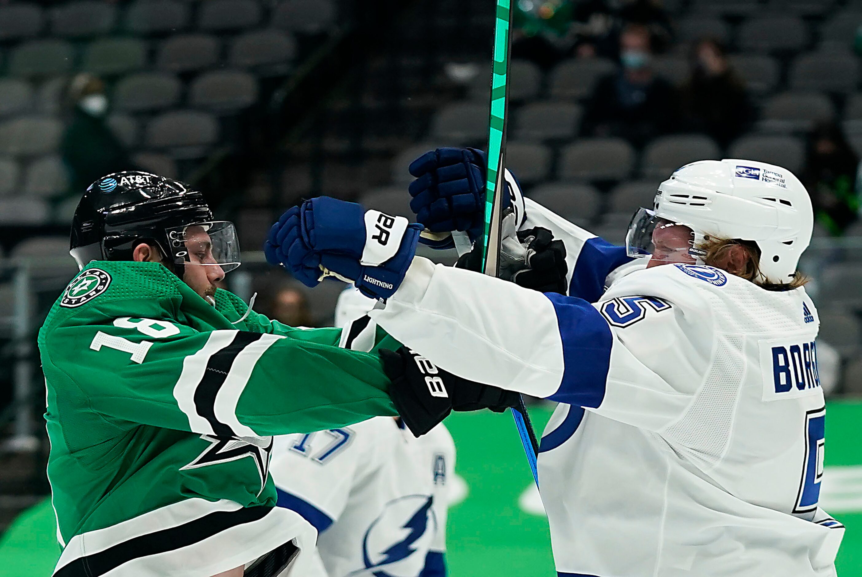 Dallas Stars center Jason Dickinson (18) tussles with Tampa Bay Lightning defenseman Andreas...