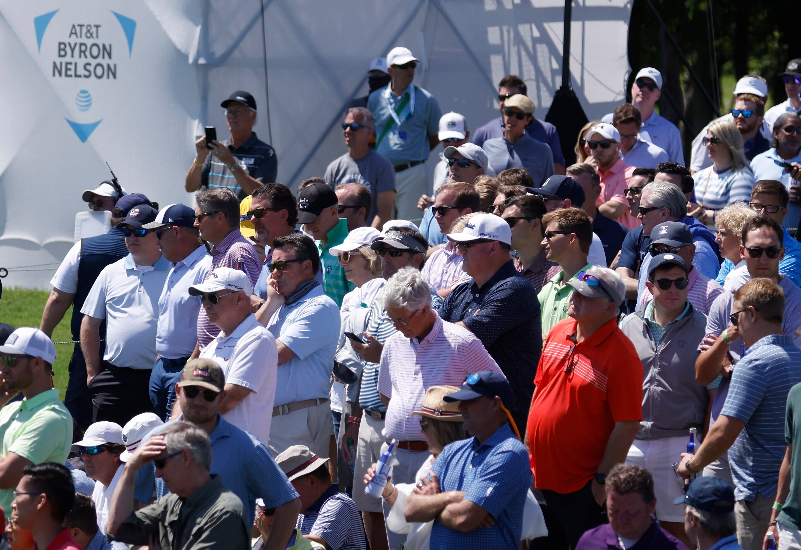 Fans watch golfers compete on the 10th hole during round 1 of the AT&T Byron Nelson  at TPC...