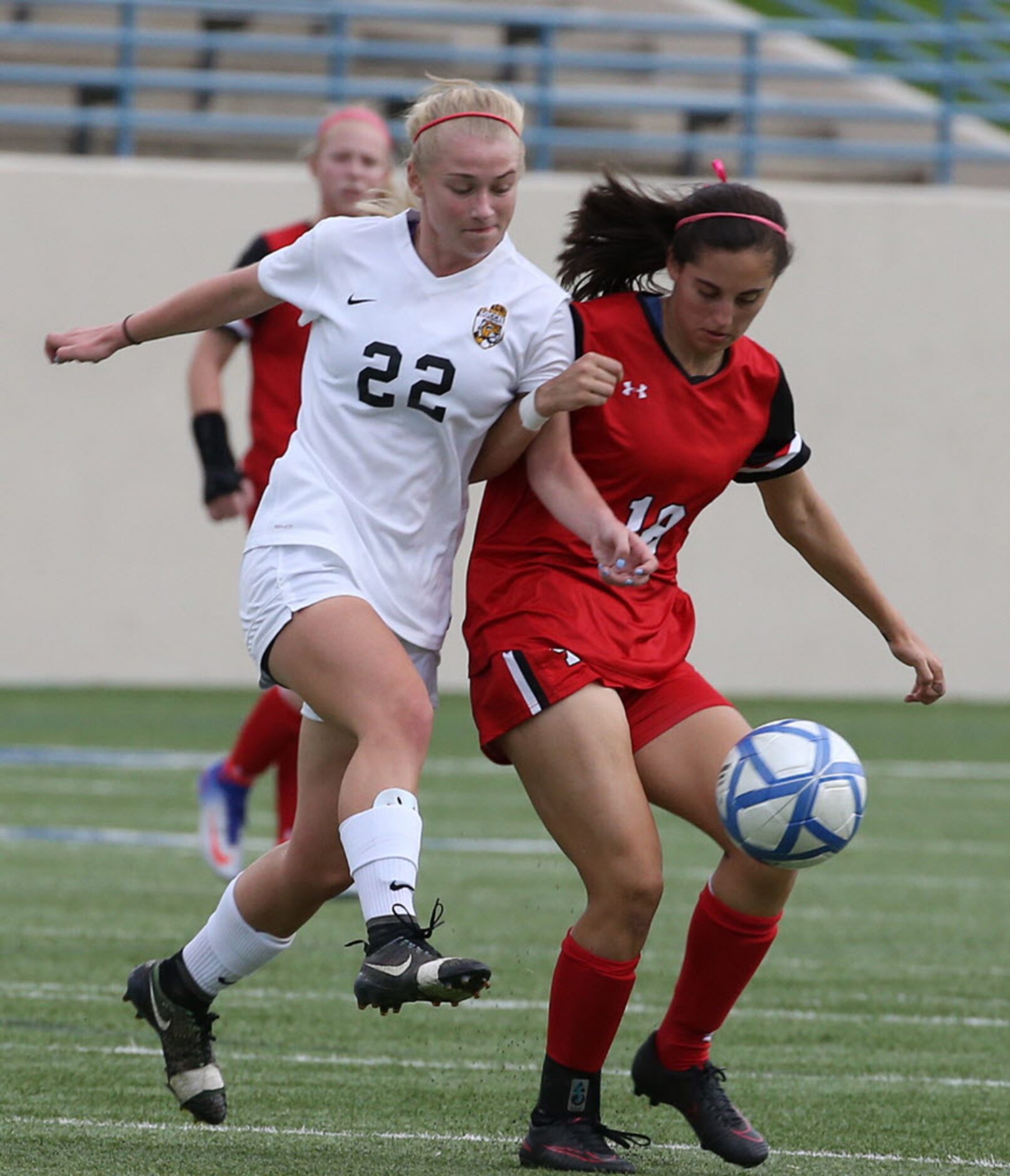 Ursuline Academys Peyton Robertson (18) and St. Agnes Academys Angela Forthuber (22)...