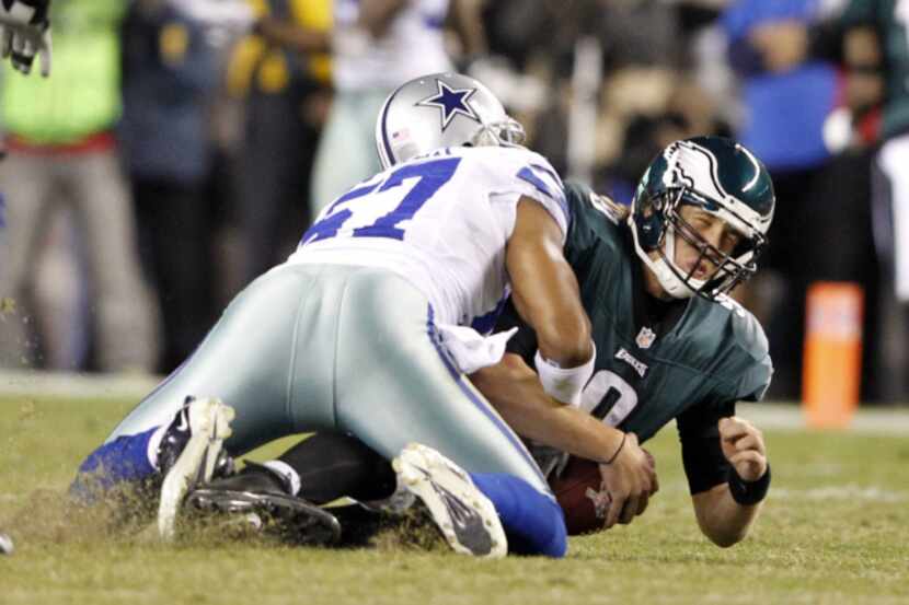 Dallas Cowboys outside linebacker Victor Butler (57) sacks Philadelphia Eagles quarterback...
