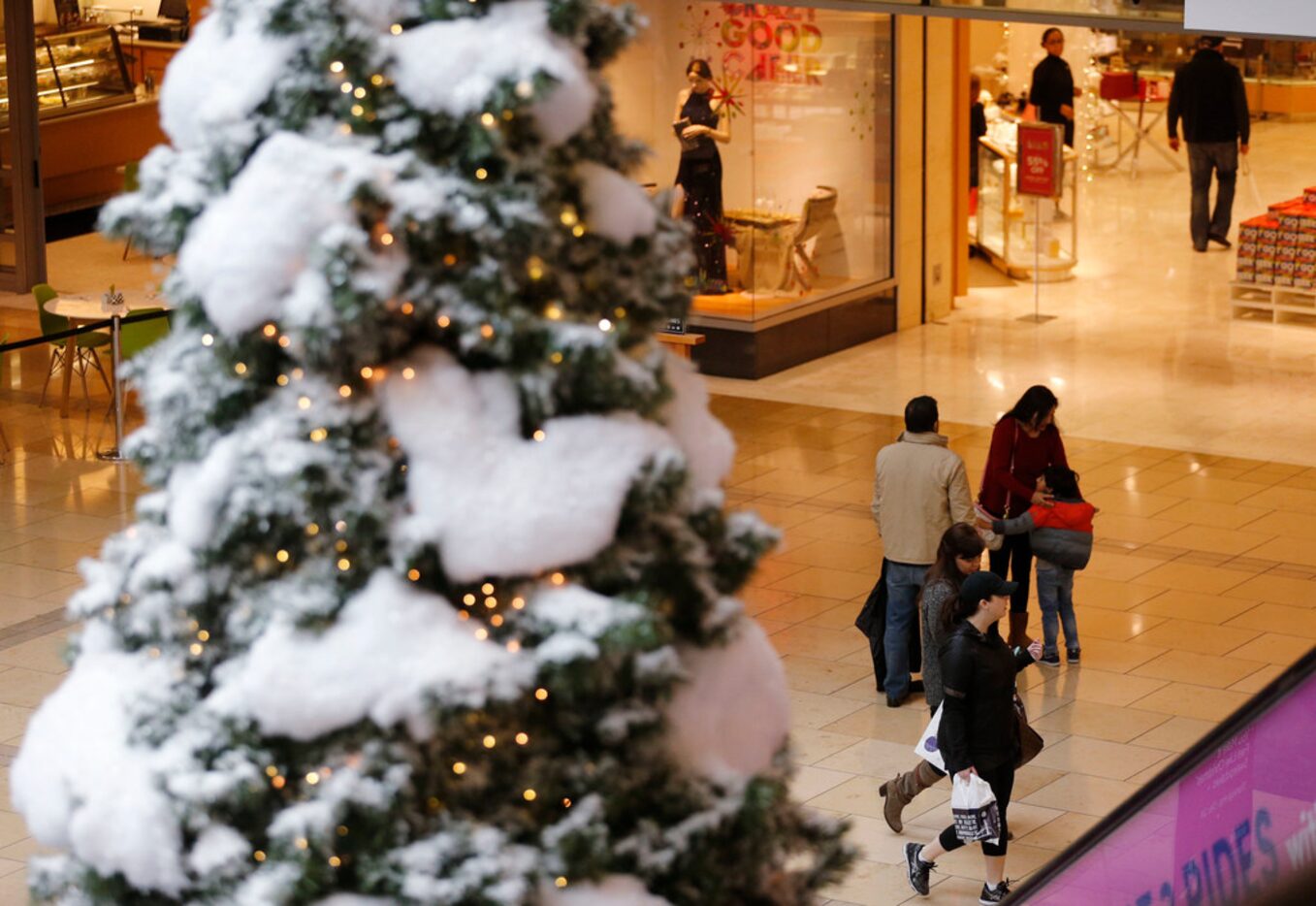 Last minute shoppers on Christmas Eve morning at Willow Bend Mall in Plano, Texas on Sunday,...