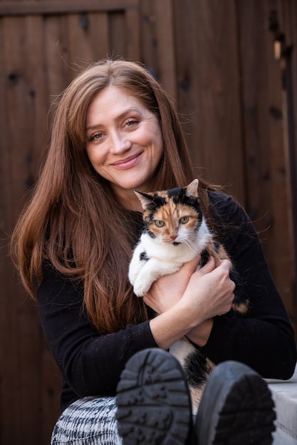 Film director Augustine Frizzell with one of her five cats at her home in Dallas, on...