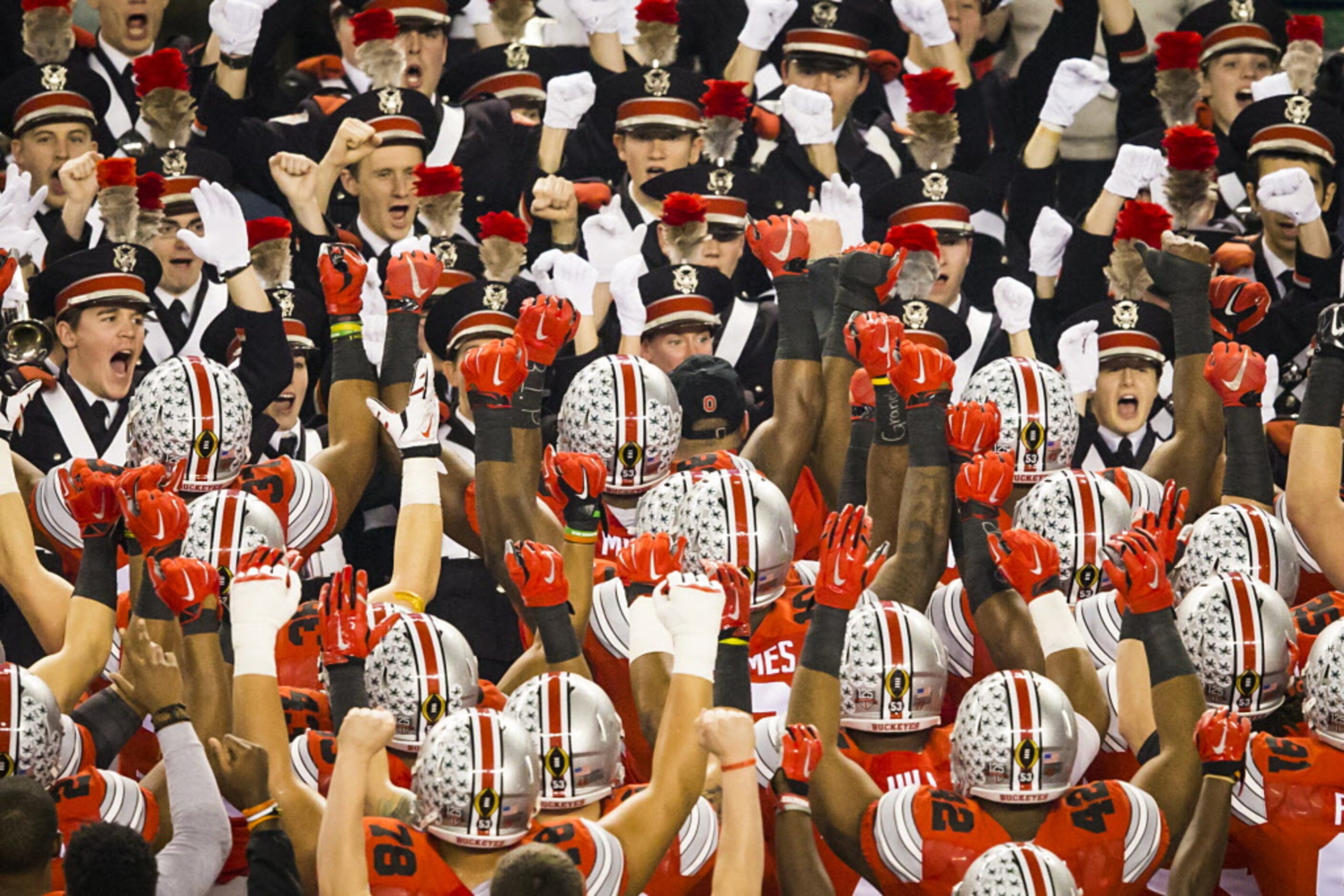 Ohio State Buckeyes players line up with their band before the College Football Playoff game...