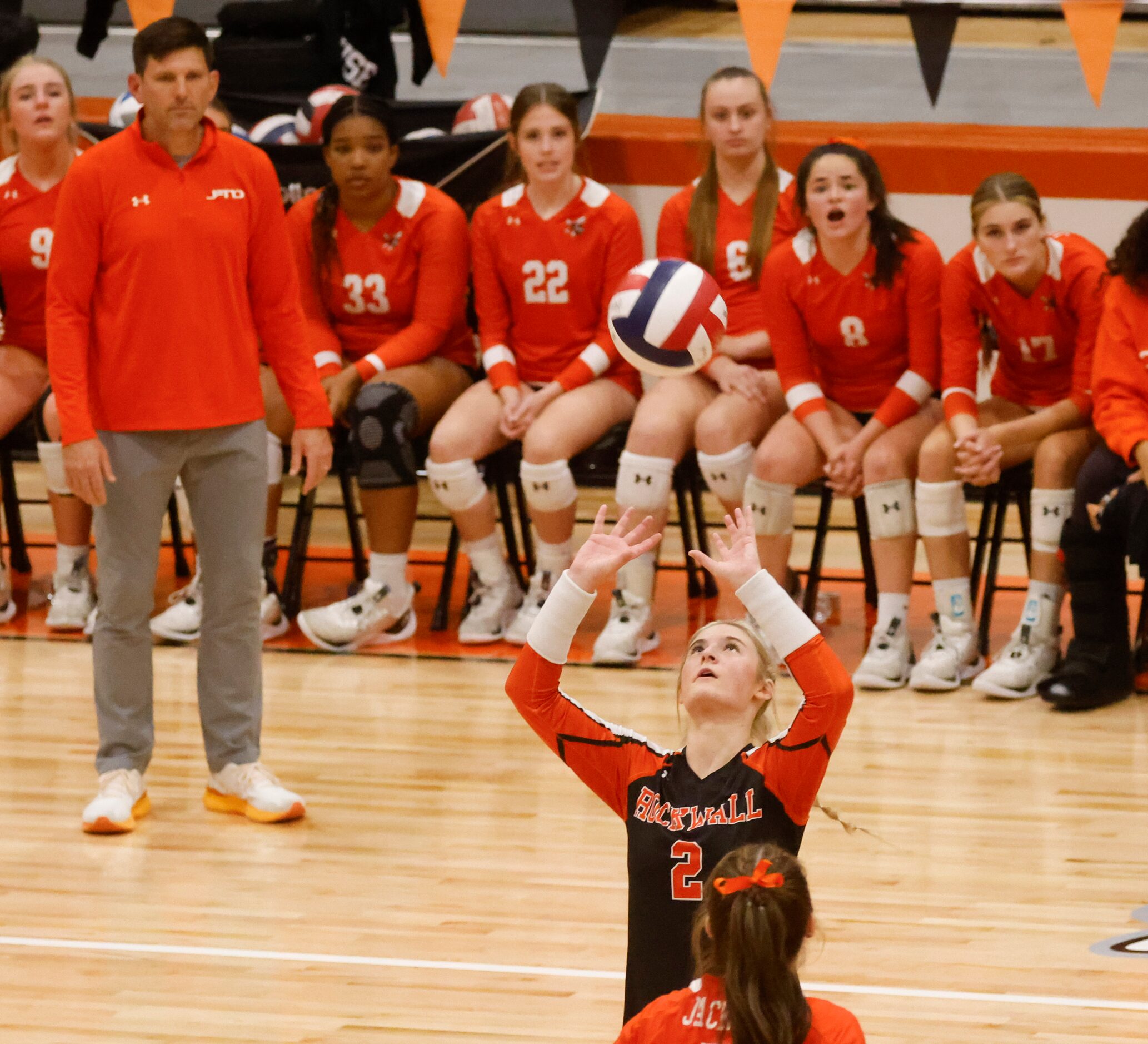 Rockwall High’s Sophia Armstrong sets the ball during a volleyball game at Rockwell Heath,...