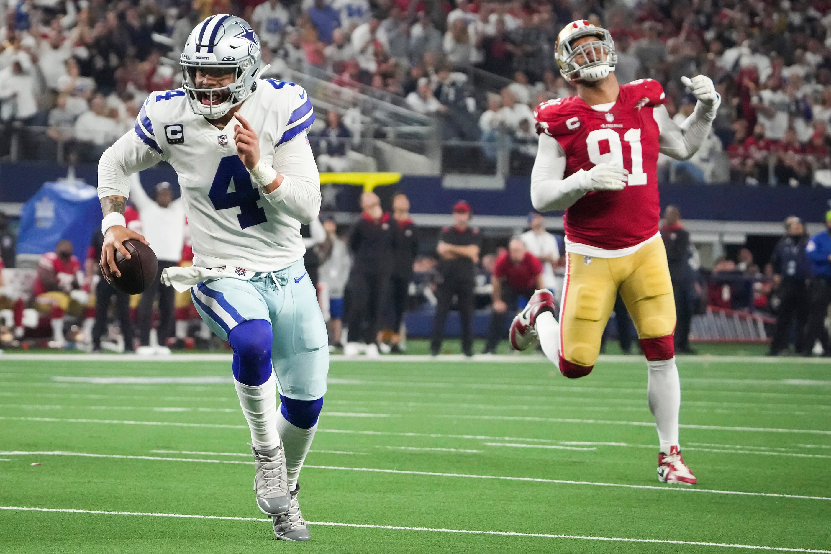 Dallas Cowboys quarterback Dak Prescott (4) runs past San Francisco 49ers defensive end Arik...