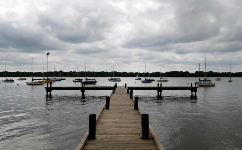 
A dock juts into the east side of White Rock Lake, near the trail that park officials and...