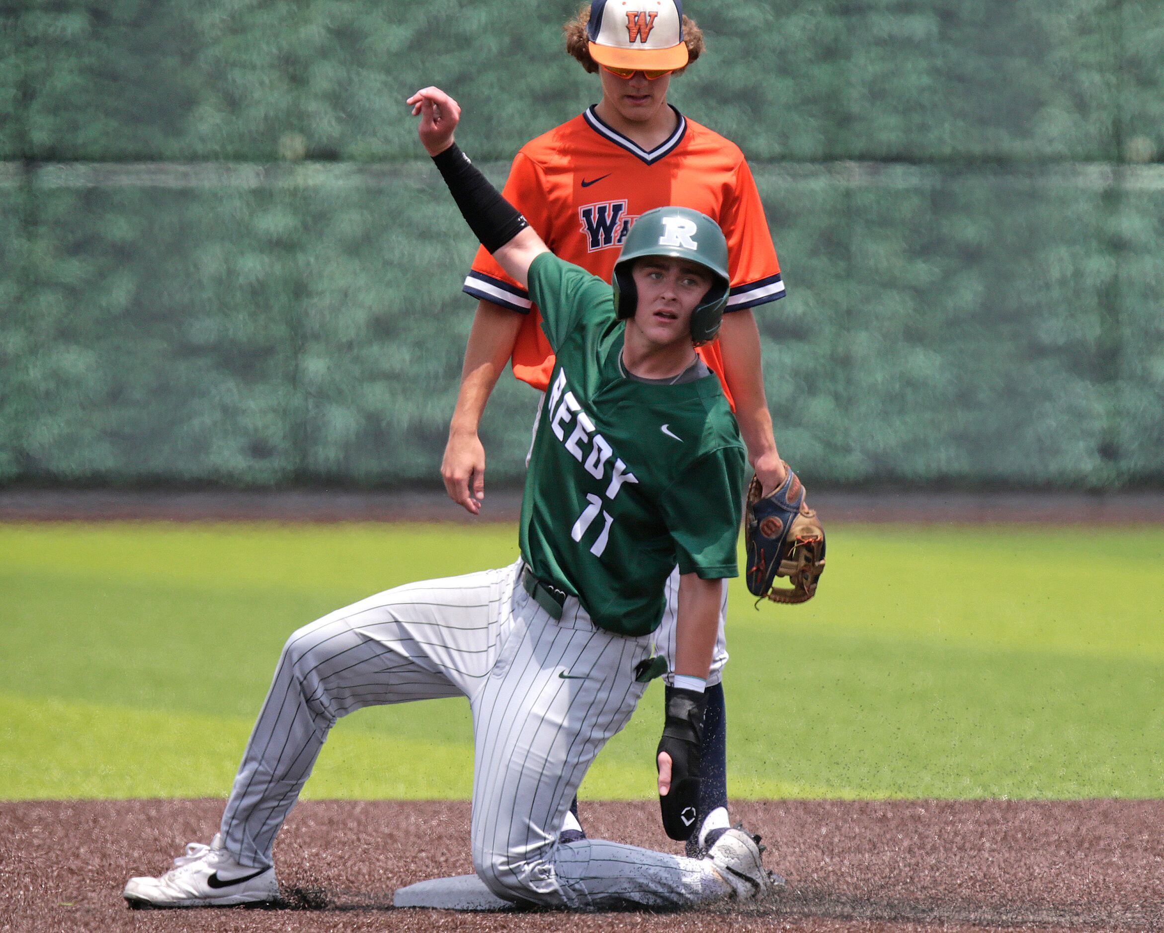 Reedy High School shortstop Brandon Huff (11) steals second base without a challenge in the...