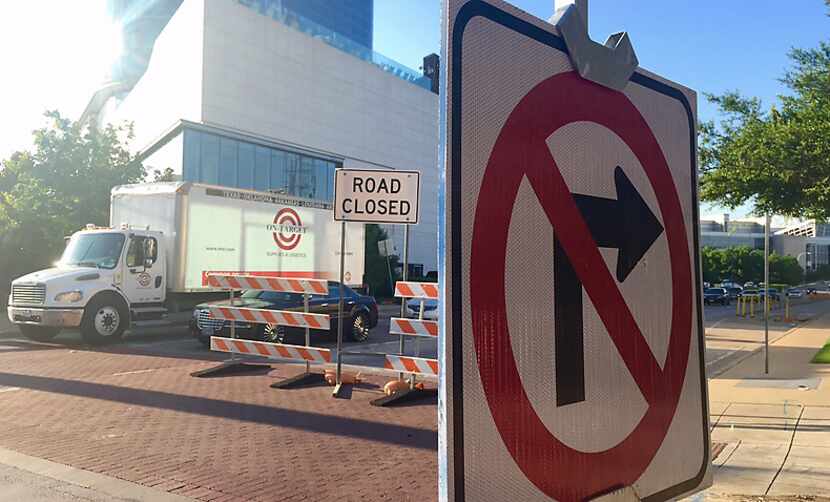 A sign and barricades were in place Monday morning to prevent drivers from turning right...