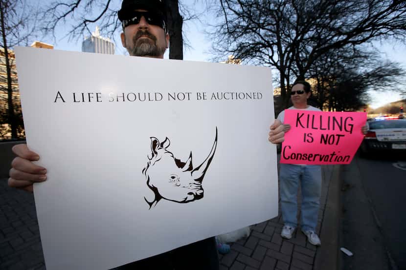 Bob Fretwell of Mesquite, Texas, holds a sign protesting outside the Dallas Convention...
