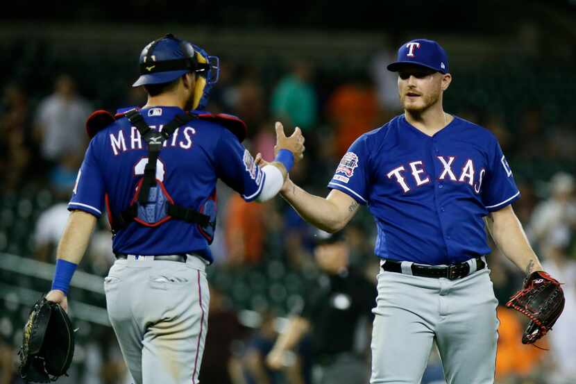 DETROIT, MI - JUNE 25:  Catcher Jeff Mathis #2 of the Texas Rangers celebrates with pitcher...