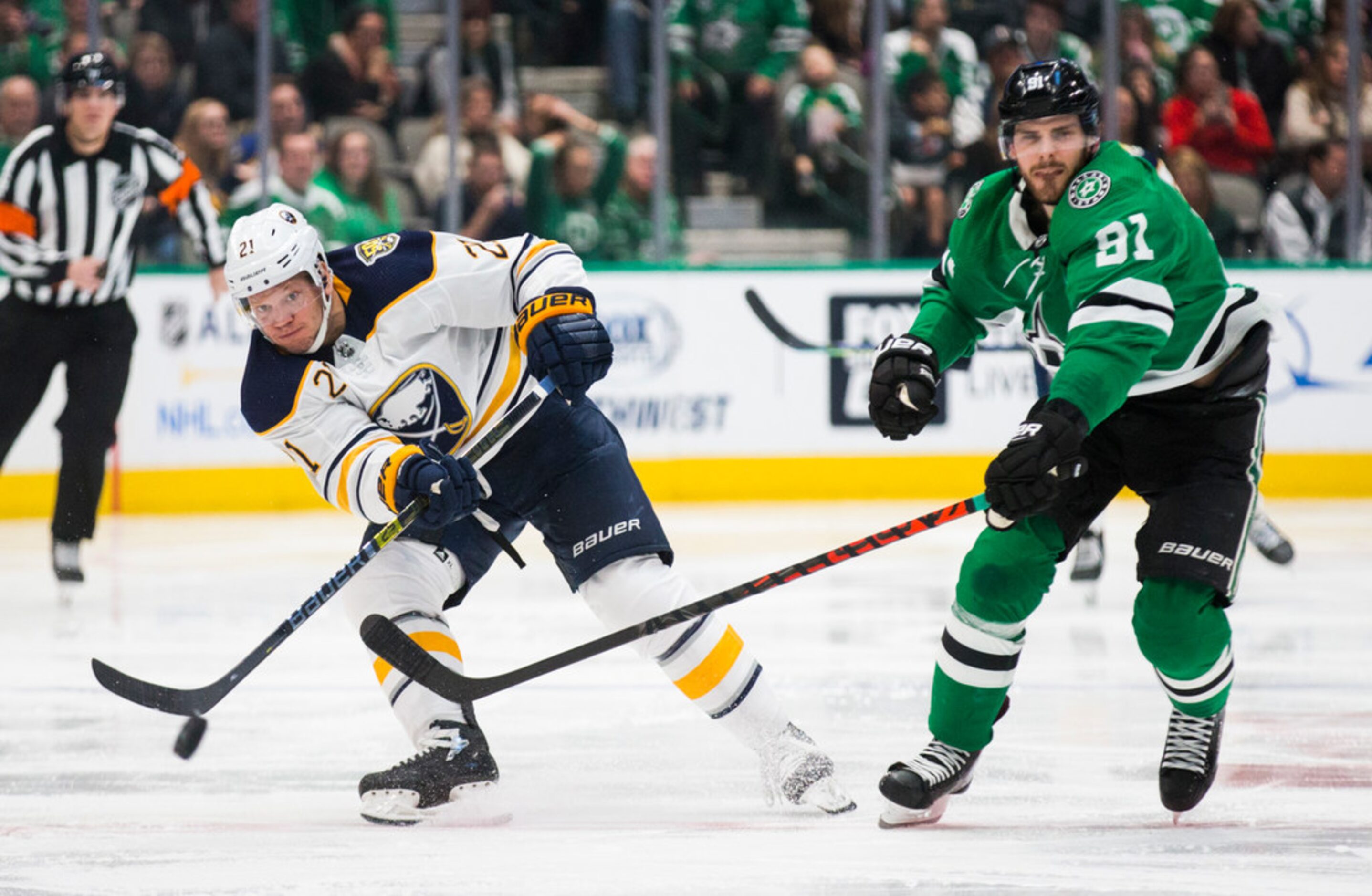 Dallas Stars center Tyler Seguin (91) tries to block a shot by Buffalo Sabres right wing...