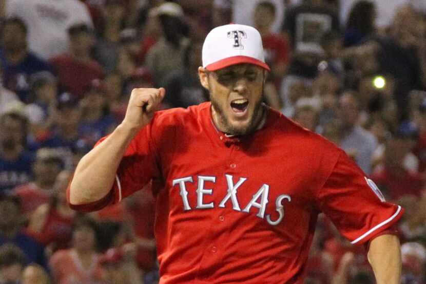 Texas closer Joe Nathan exults as strike three is called on the final batter in the Rangers'...