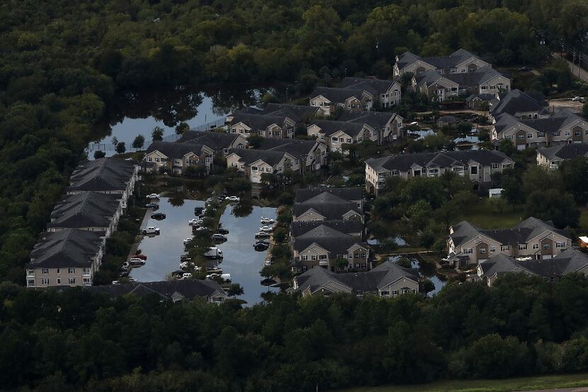 A Houston housing development sits in floodwaters over a week after Hurricane Harvey hit...