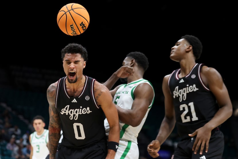 Texas A&M guard Jace Carter (0) celebrates after making a basket while being fouled during...