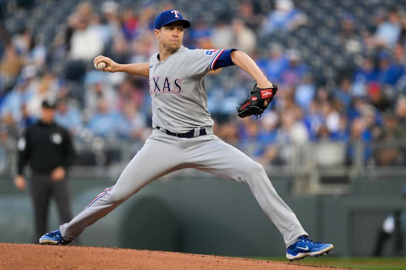 Texas Rangers starting pitcher Jacob deGrom throws to a Kansas City Royals batter during the...