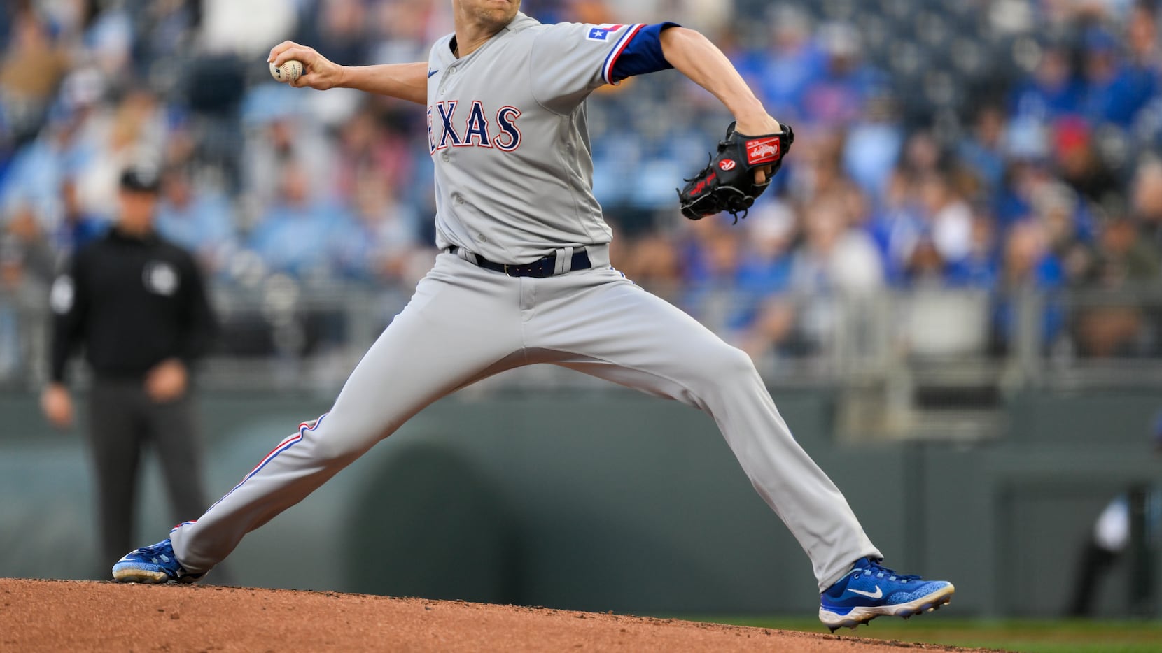 Texas Rangers starting pitcher Jacob deGrom throws to a Kansas City Royals batter during the...
