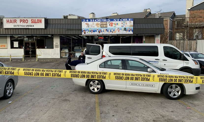 Workers from the Dallas County Medical Examiner's Office loaded Mohamed Abdi Mohamed's body...