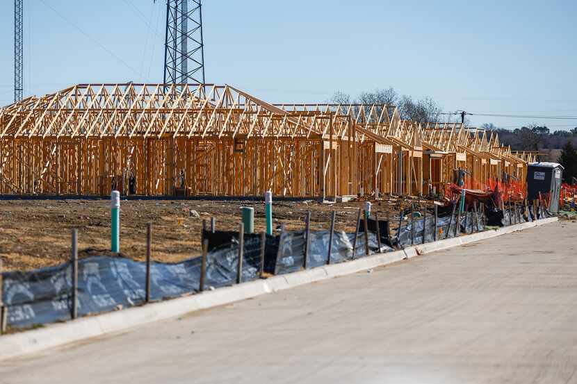 Homes under construction are shown in the Lennar at Trinity Crossing subdivision in Forney...
