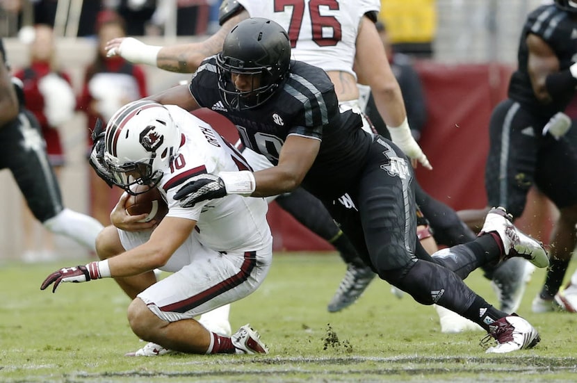 Texas A&M Aggies defensive lineman Daeshon Hall (10) sacks South Carolina Gamecocks...