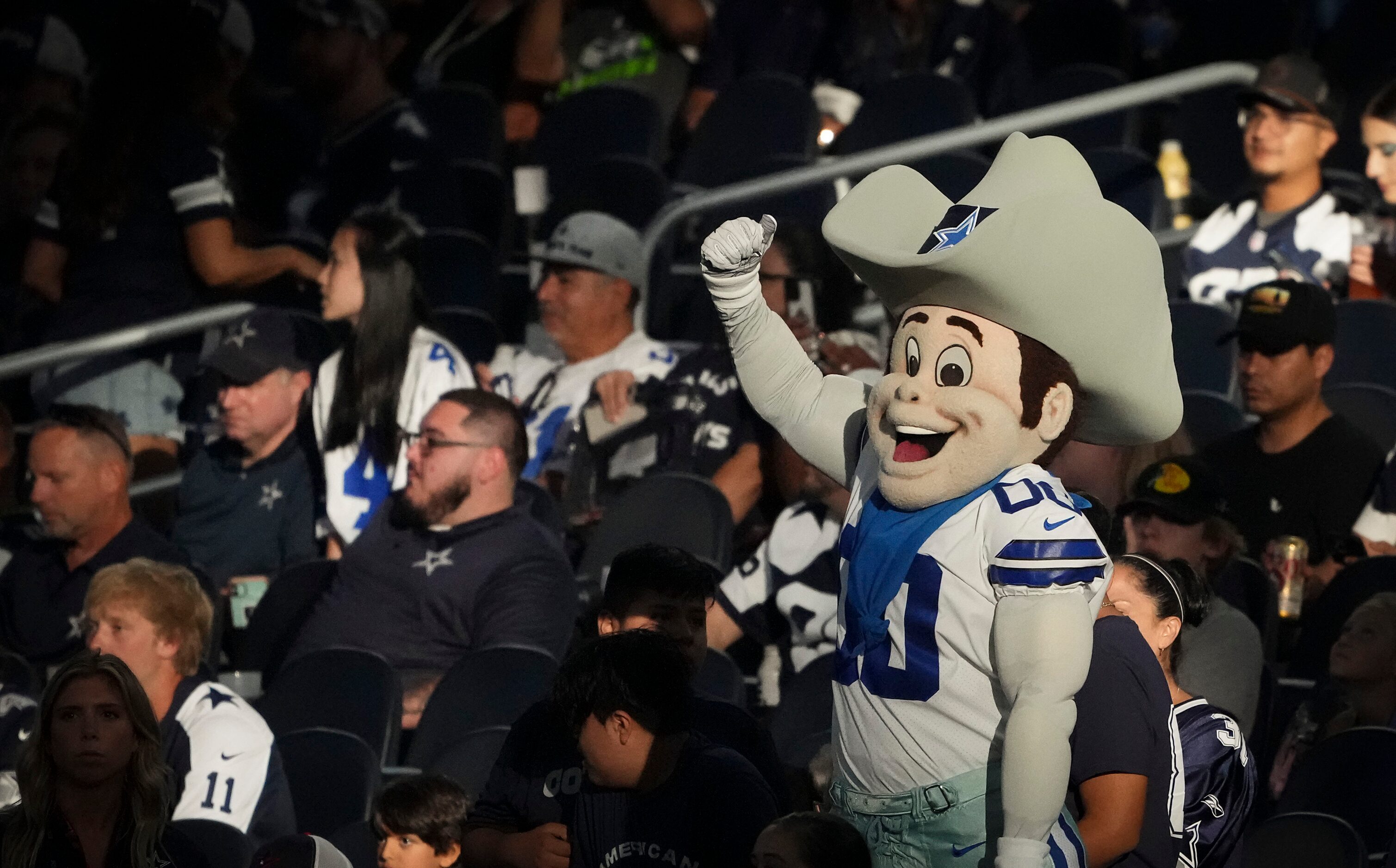 Dallas Cowboys mascot Rowdy tries to fire up the crowd before an NFL preseason football game...