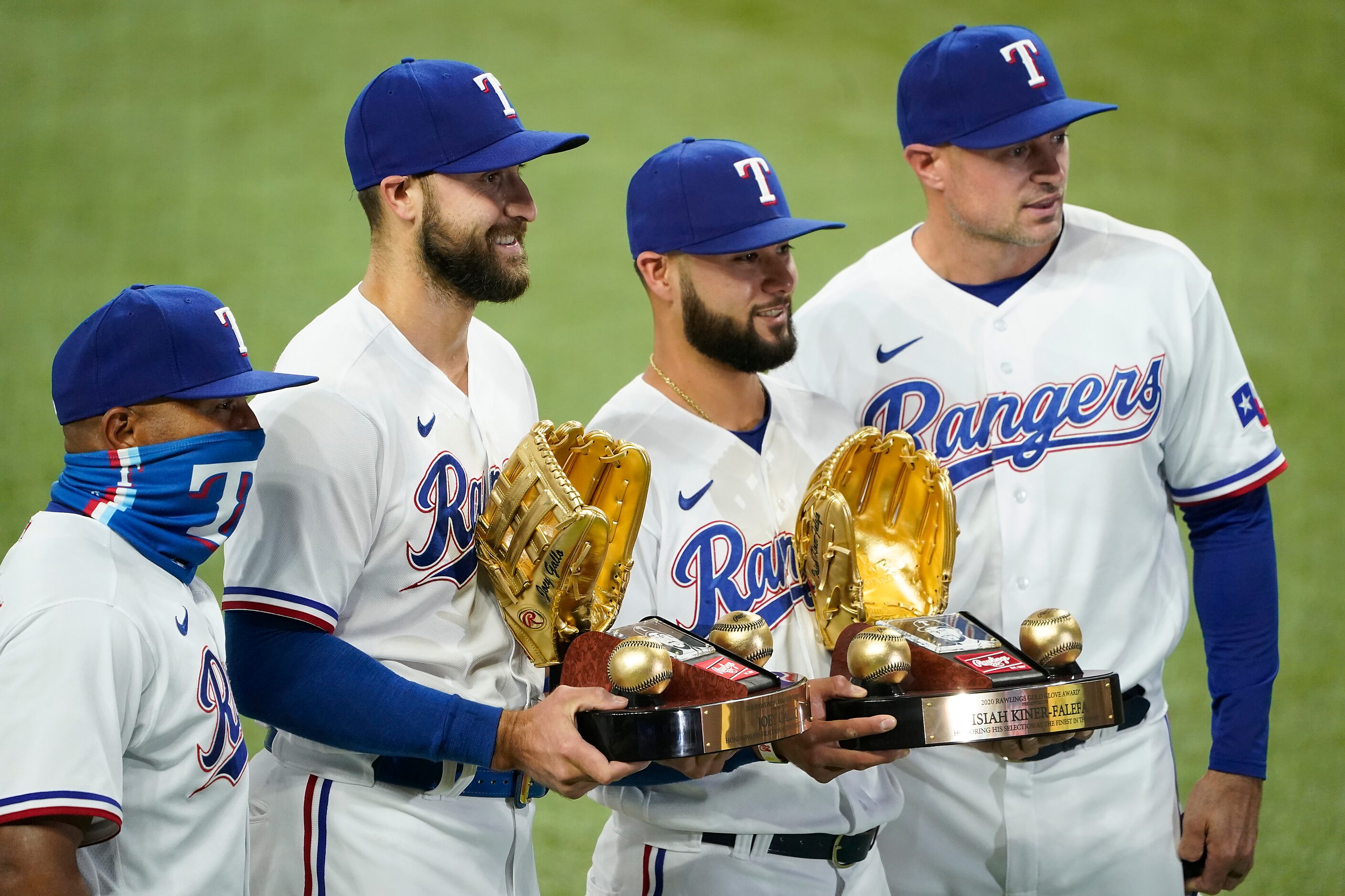 Texas Rangers right fielder Joey Gallo and shortstop Isiah Kiner-Falefa are presented their...