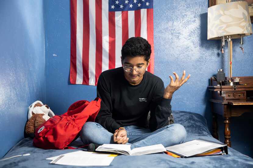 Duncanville High School student David Mojica,  

15, looks at his French homework in his...