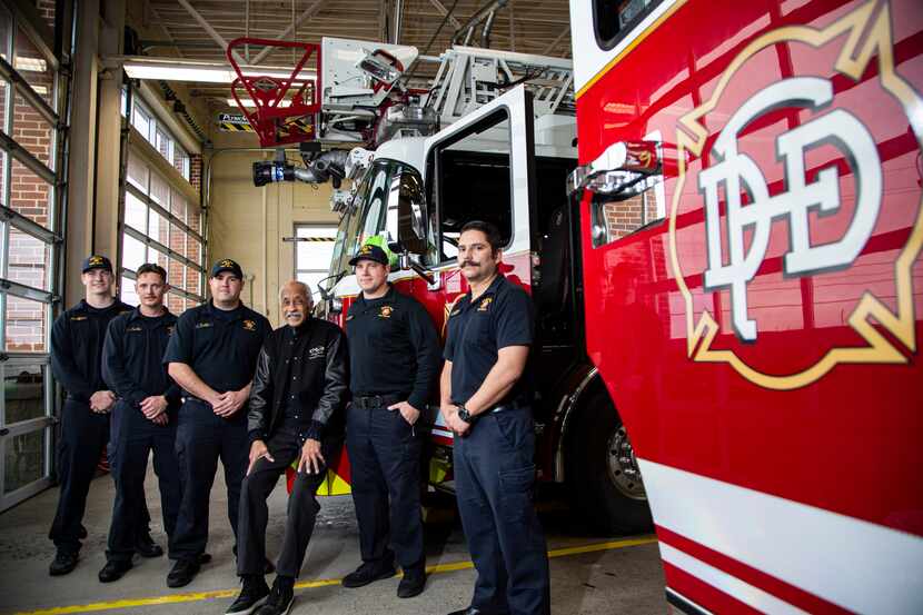 Retired Dallas Fire Department Lt. Crest Whitaker Sr. (fourth from left) poses for a photo...