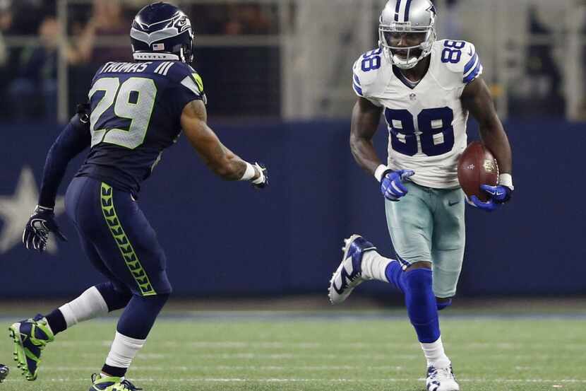 Dallas Cowboys wide receiver Dez Bryant (88) after the catch attempting to evade Seattle...