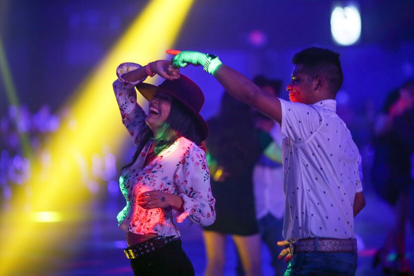 Young couple dance during a music concert at the Farwest Nightclub.. With the new executive...