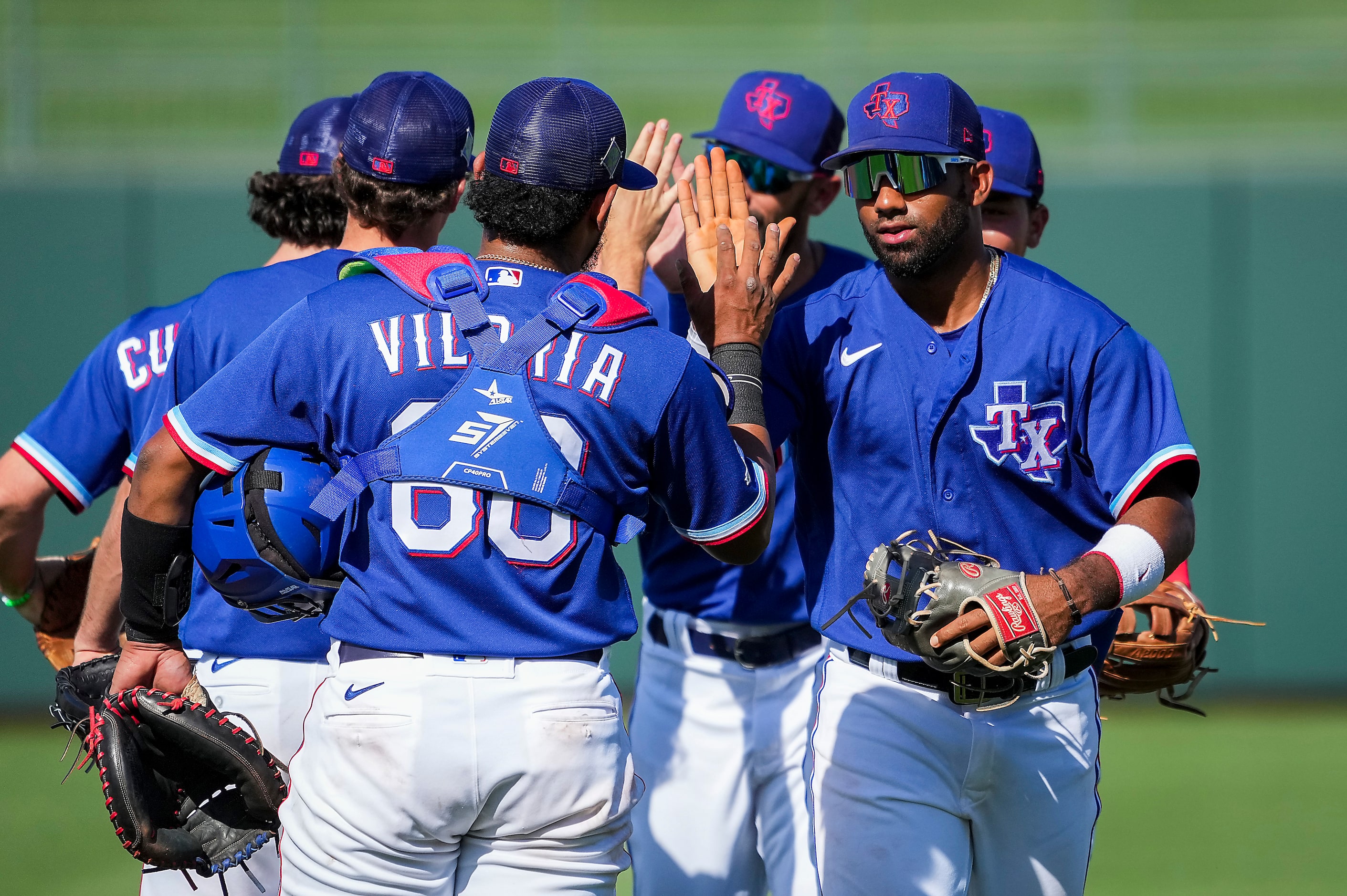 Texas Rangers shortstop Ezequiel Duran celebrates with catcher Meibrys Viloria after a...