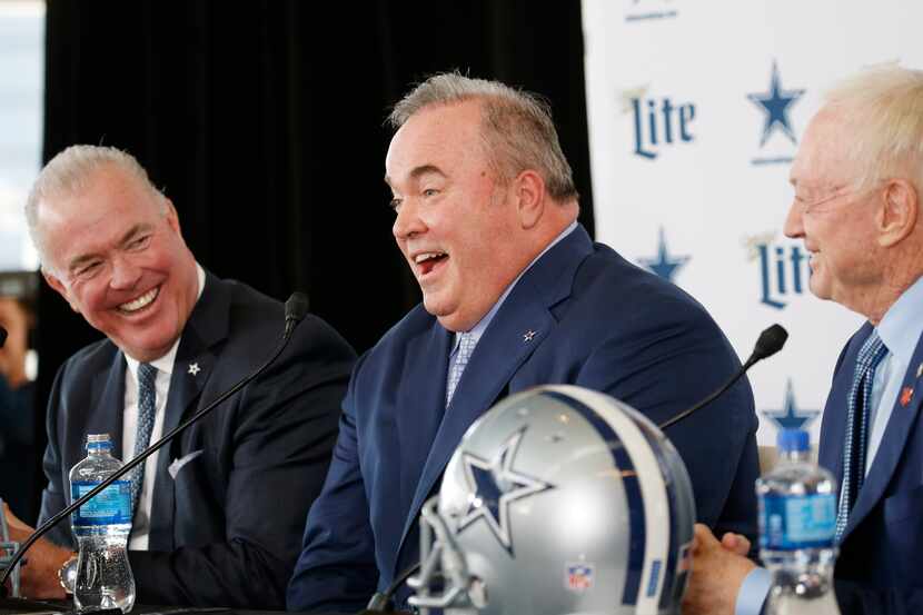 Dallas Cowboys new head coach Mike McCarthy (center) shares a laugh with Dallas Cowboys...