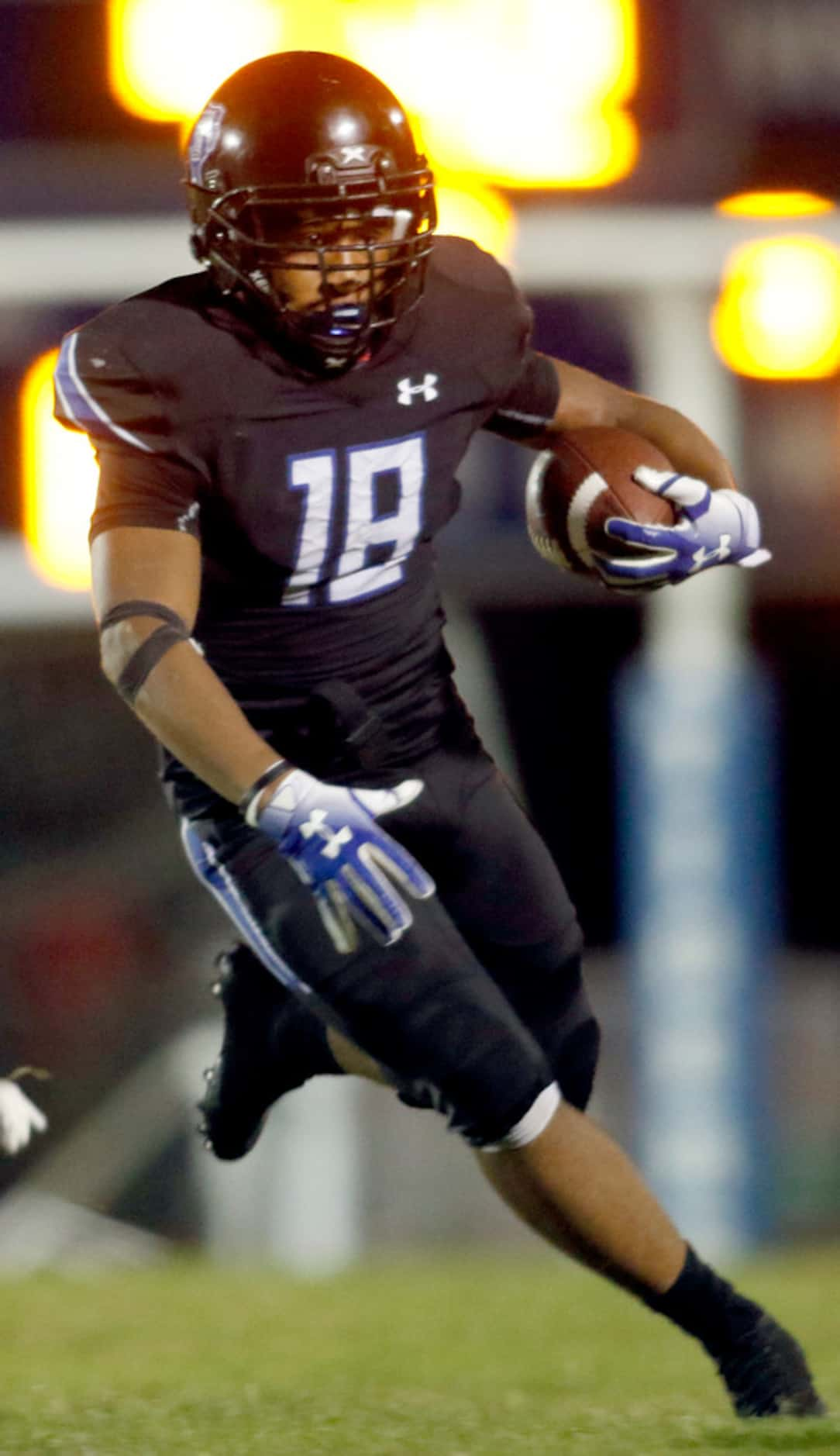 Trinity Christian running back Emari Matthews (18) emerges from the backfield on a delayed...