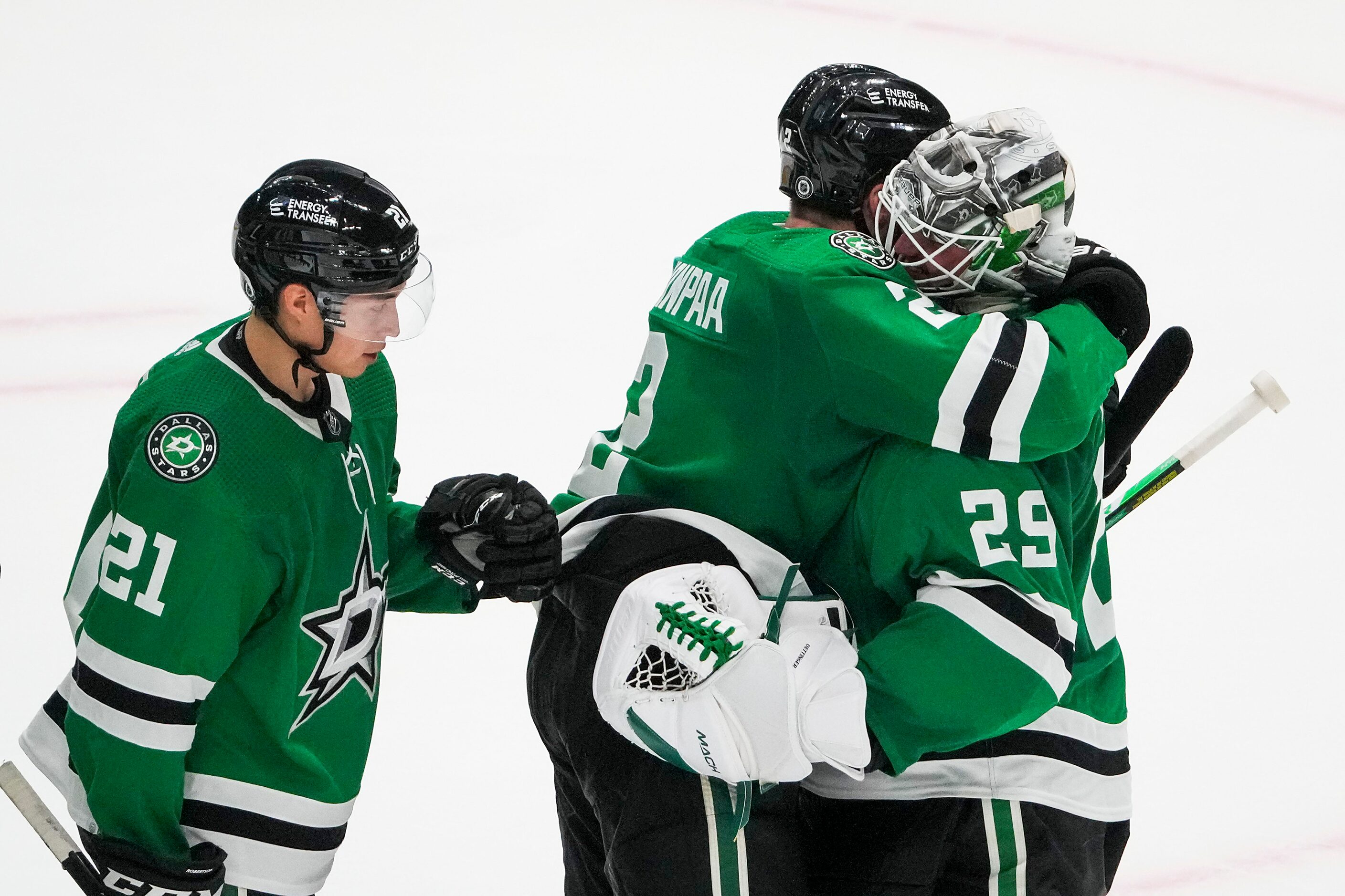 Dallas Stars goaltender Jake Oettinger (29) celebrates with defenseman Jani Hakanpaa (2) and...