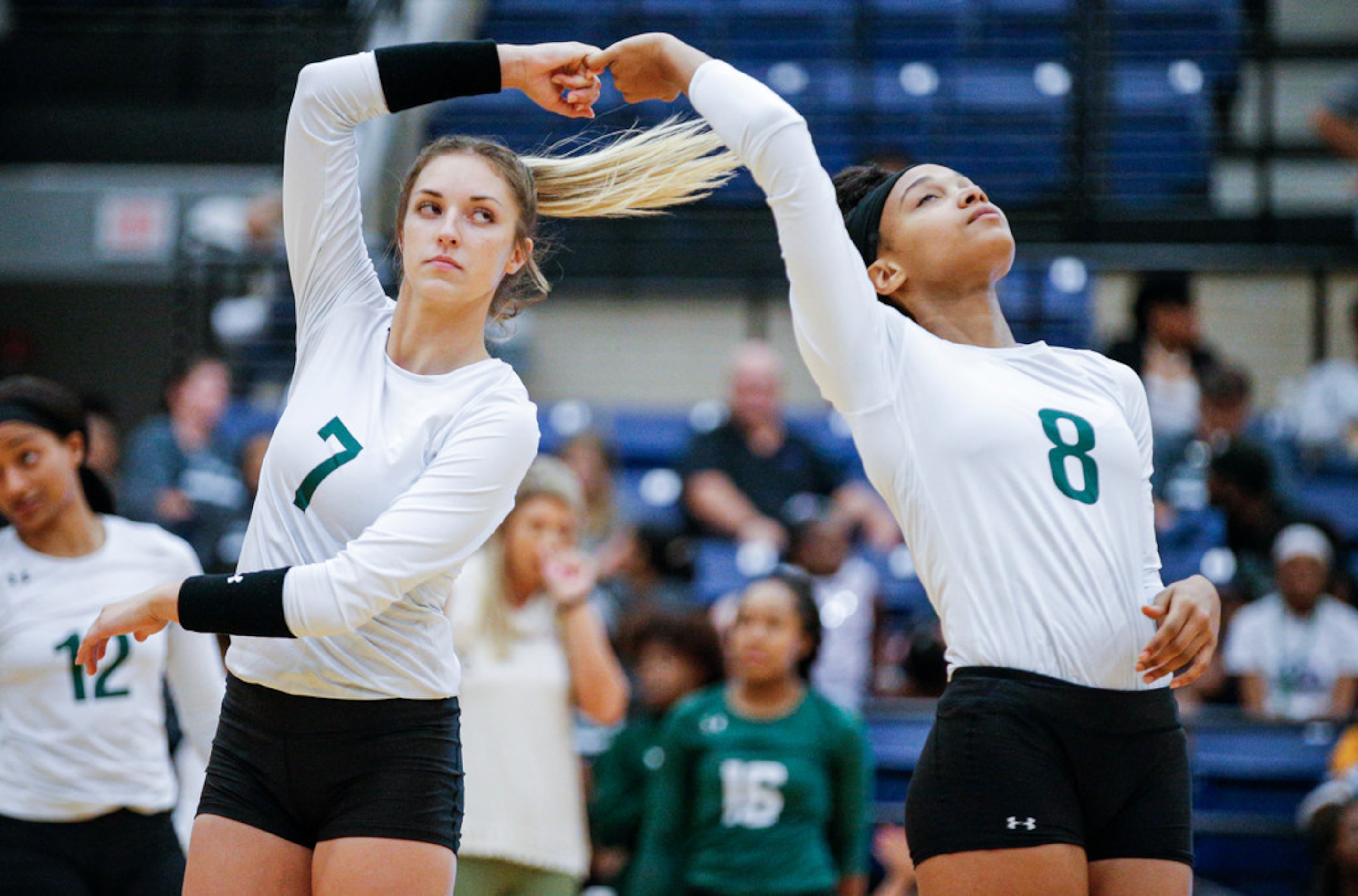 Mansfield Lake Ridge senior Logyn Hinds (7) and junior Lyric Stewart (8) participate in a...