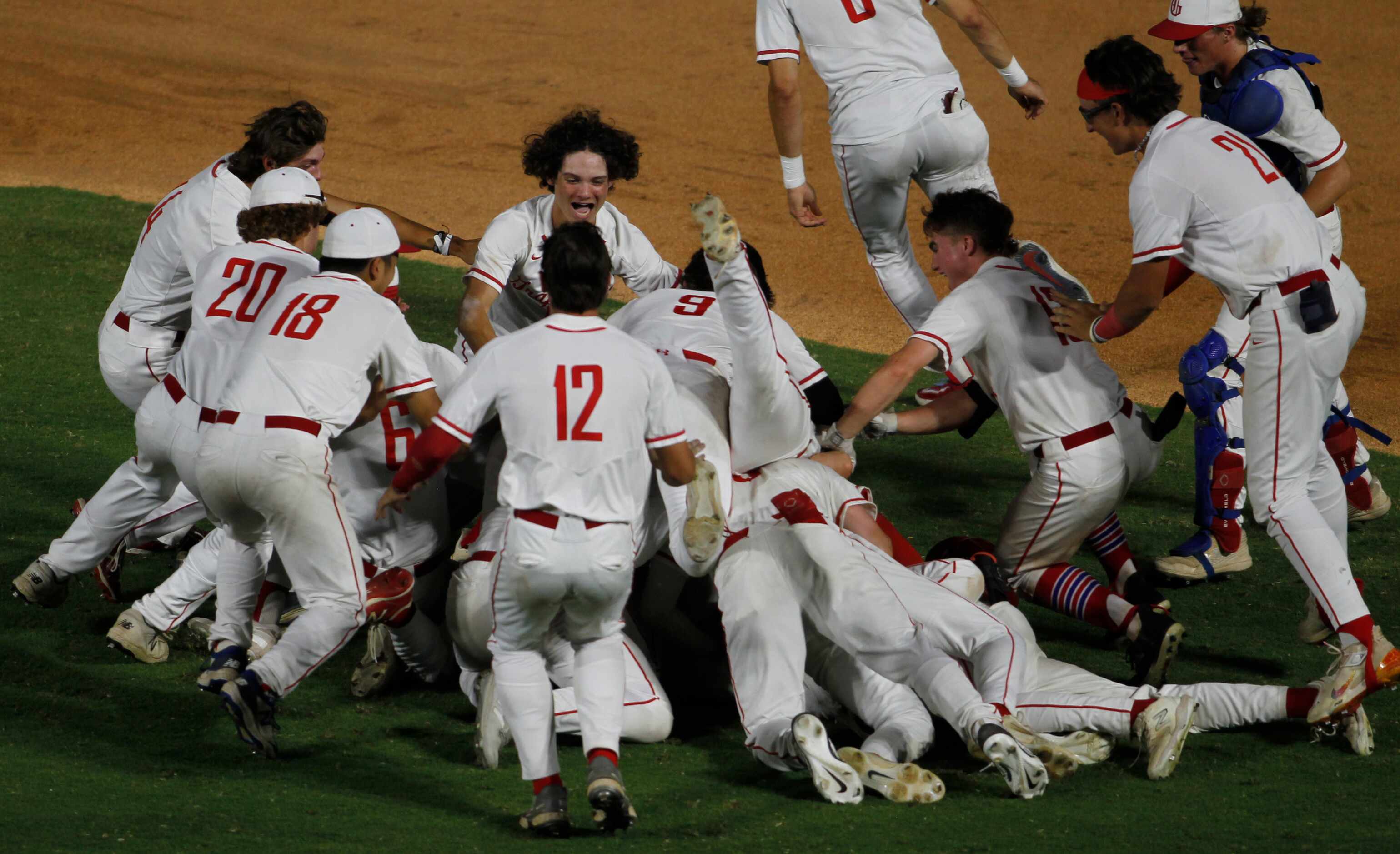 Grapevine players celebrate their 2-1 come-from-behind victory over Leander Rouse to advance...