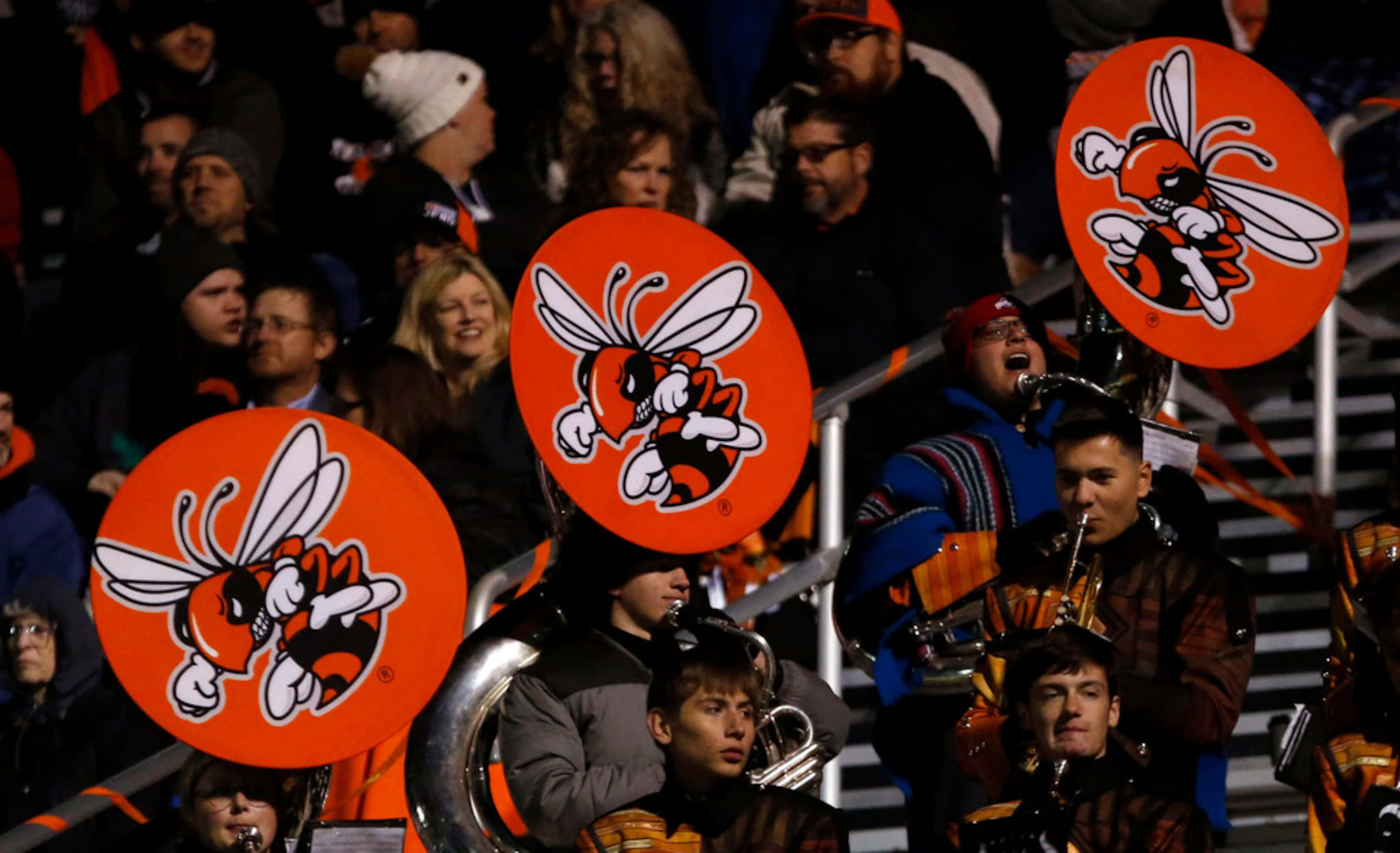 Tubas in the Rockwall band sport yellowjacket covers during the first half of the Mesquite...