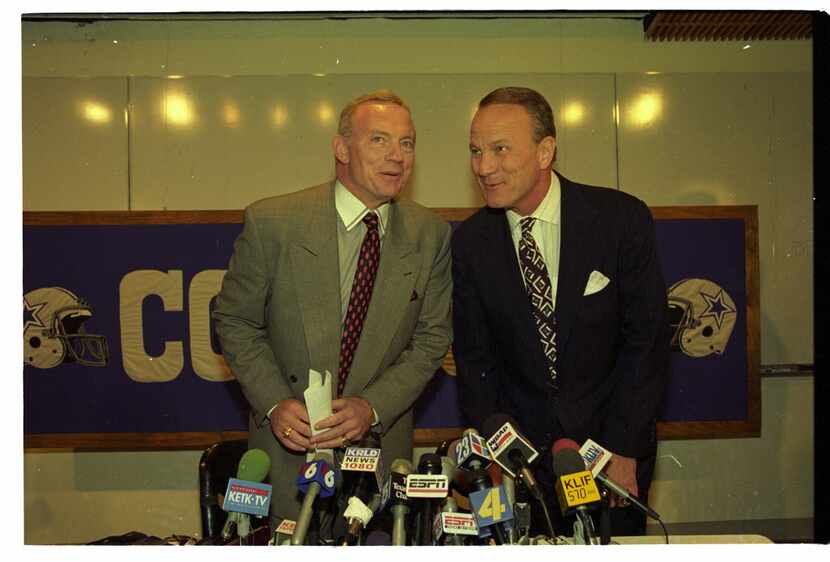 Shot March 30, 1994 - Jerry Jones, (L) and Barry Switzer chat with one another at a news...